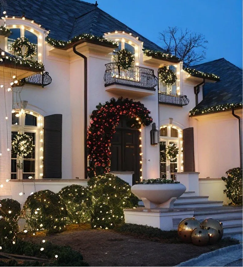 Garland and wreaths across a home entrance