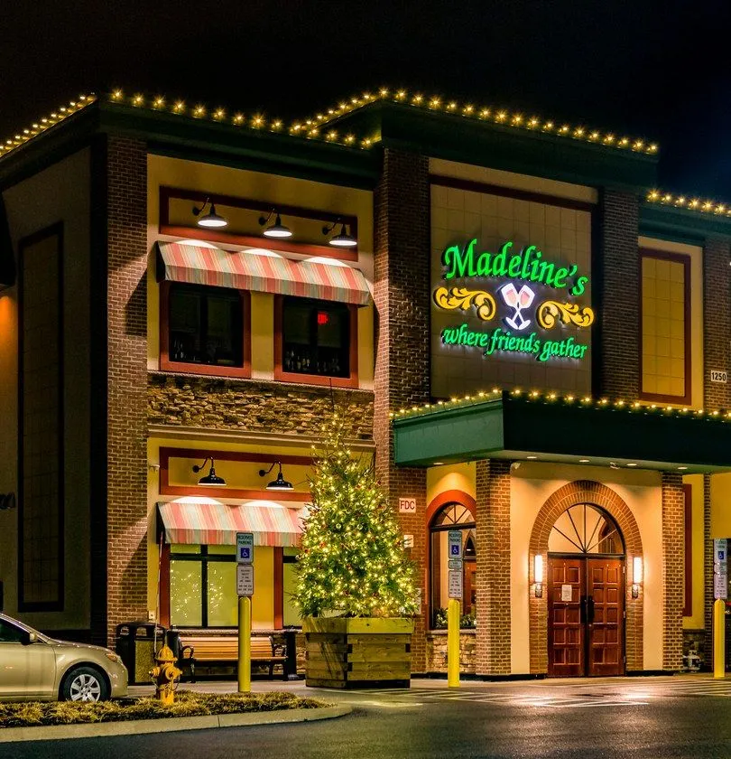 Commercial holiday light installation on retail storefront