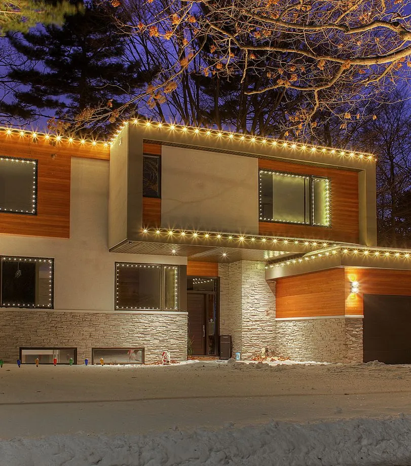 A modern home edged in permanent warm white lighting