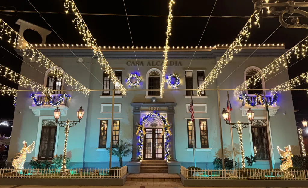 The same square under an overhead canopy of lights