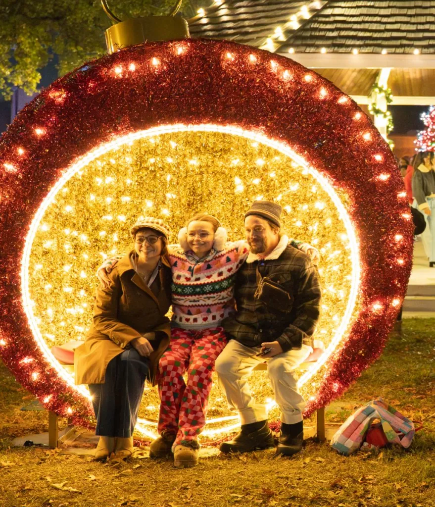 Family with holiday lighting
